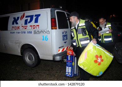 ASHKELON - JAN 29 2007:ZAKA Voluntaries Giving Warm Blankets For Poor Families.Zaka's Mission Is To Rescue And Recover Victims Following Terror Attacks, Bombings, Or Natural Disasters