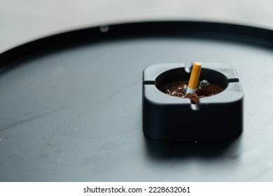 ashtray on table, cigarette, don't smoke - Shutterstock ID 2228632061