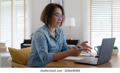 Asia Adult Happy People Or Sme Owner Latin Lady Sit Consult Talk In Online Seminar Reskill Upskill Job Discuss Class For Worker On Desk Table Work At Home In Remote Teach Advice By Digital Training.