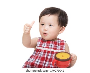 Asia Baby Girl With Snack Box And Thumb Up