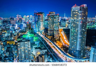 Asia business concept for real estate and corporate construction - panoramic urban city skyline aerial view under twilight sky and neon night with highway junction in hamamatsucho, tokyo, Japan - Powered by Shutterstock