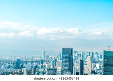 Asia Business Concept For Real Estate And Corporate Construction - Panoramic Urban City Skyline Aerial View Under Bright Blue Sky And Sun In Tokyo, Japan