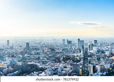 Asia Business concept for real estate and corporate construction - panoramic modern city skyline bird eye aerial view of main road under bright sun and vivid blue sky in Roppongi Hill, Tokyo, Japan