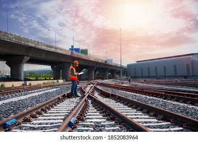 Asia Construction Worker On Railways. Engineer Work On Railway With Labor On Background. Rail, Engineer, Infrastructure.