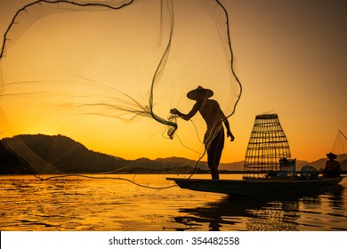 Asia Fishermen on boat fishing at lake 

