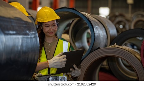 Asia Girl Heavy Industry Foreman Factorial Worker Check Stock Of Metal Steel Rolls Material Sheet In Manufacturing Factory Production Line 