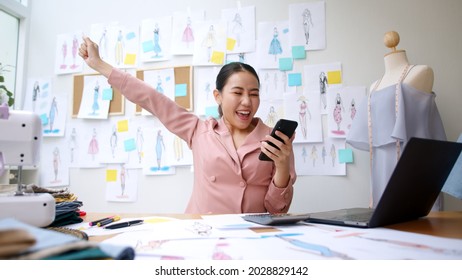 Asia happy people or lady excited sell smile enjoy good news work at home studio office store shop read text of bank fund money approve with crazy joy, sale job win. P2P microfinance app for SME sale. - Powered by Shutterstock