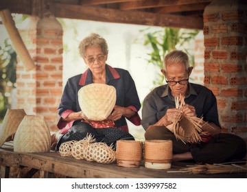 Asia Life Couple Old Man Grandfather And Old Woman Working In Home / Grandmother Elderly Living In The Countryside Of Life Rural People In Thailand Weaving Bamboo Making Basket Crafts