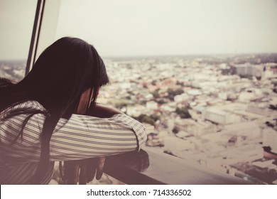 An Asia Lonely Woman Sitting With Loneliness Thinking To Something With Sadness. 