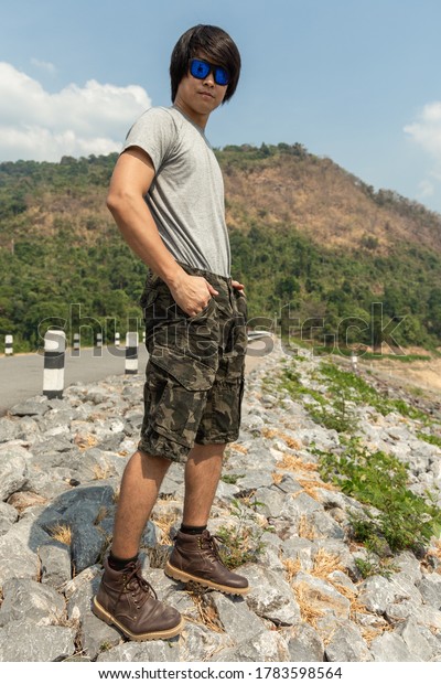 Asia man in bermuda shorts and t-shirt, outdoor\
activity concept