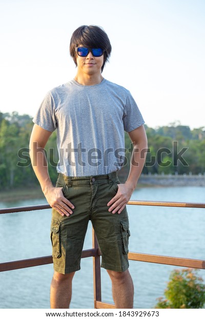 Asia man in bermuda shorts and t-shirt, outdoor
activity concept
