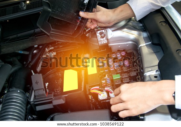Asia man with engine on\
blurry background.For automotive or Maintenance, service or\
transport image.