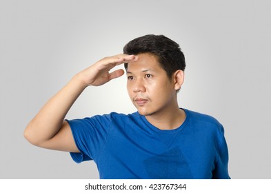 Asia man is looking for something, isolated on gray background - Shutterstock ID 423767344