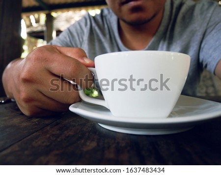 Asia man selfie and drinking hot coffee in the morning.
