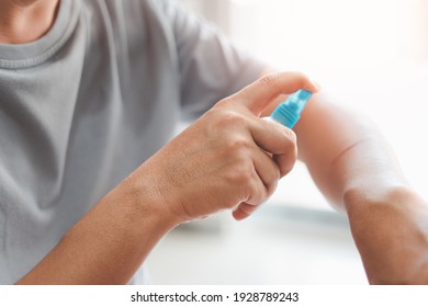 Asia Man Is Spraying Alcohol To Arm For Cleaning From A Cat Scratch Wound And Disinfection In First Aid Concept Bleeding Wounds 