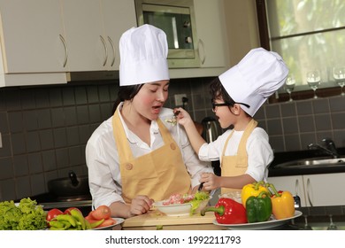 Asia Mother And Son Cooking In Kitchen , Son Ask Mom To Test Sald Made By Himself , Food Cooking Trainng Course 