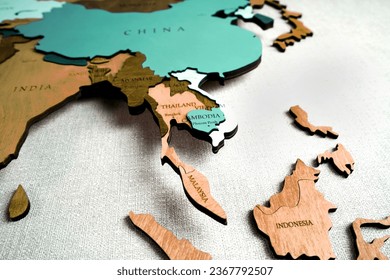 Asia on the political map. Wooden world map on the wall. Thailand, Vietnam, Indonesia, Cambodia, Malasia countries                           