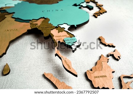 Asia on the political map. Wooden world map on the wall. Thailand, Vietnam, Indonesia, Cambodia, Malasia countries                           