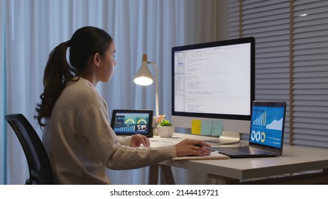 Asia people MBA college woman work busy late night home office online study on laptop typing coding search data for future job career reskill upskill in workforce IT cyber class remote virtual learn. - Powered by Shutterstock