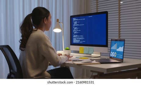 Asia people MBA college woman work busy at late night home office online study on laptop typing coding search data for future job career reskill upskill workforce IT cyber class remote virtual learn. - Powered by Shutterstock