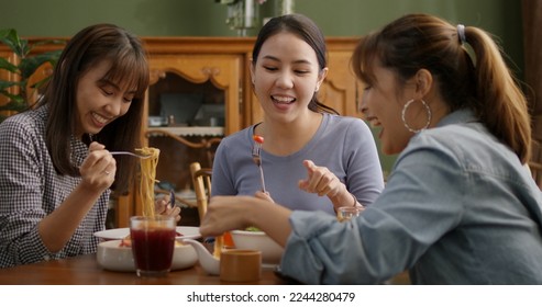 Asia people success young teen girl female group taste tasty buffet dining sit talk or share in youth culture social joy cozy relax leisure dinner hour party guest at reopen indoor casual cafe bar. - Shutterstock ID 2244280479