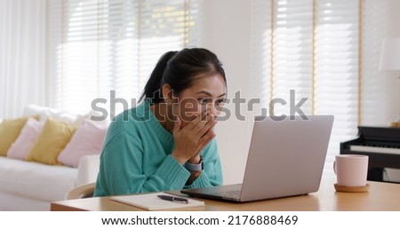 Asia people teen girl young worker workforce work at home office on table happy joy laugh smile with good news of job hired result on laptop, staff award bonus, win online trade, sale order, loan pay.