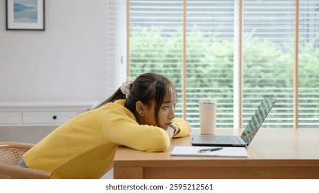 Asia people young woman study hard brownout bored remote work coding online read data tired sitting lying down at home desk think worry in career job tough stress workforce mental health issue illness