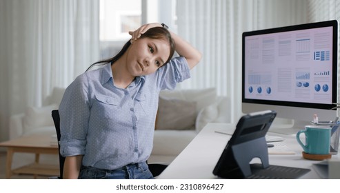 Asia people young woman worker work at home job video call telemedicine online clinic app for workforce care meet chat or tele consult to doctor remote advice teach to relax stiff neck or wrist pain. - Powered by Shutterstock