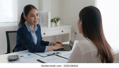 Asia real estate sale agent, stock market trader woman work at bank office talk in tax plan report. Lawyer help ask or advice lease on laptop desk typing fund loan data. Smile happy trust in HR job. - Shutterstock ID 2102130424
