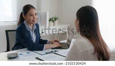 Asia real estate sale agent, stock market trader woman work at bank office talk in tax plan report. Lawyer help ask or advice lease on laptop desk typing fund loan data. Smile happy trust in HR job.