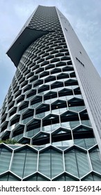 ASIA, SINGAPORE - 11 December 2020 : Modern Unique Exterior Design High Scrapper Office Cum Hotel And Residential Apartments From Low Angle View Looking Up, In City CBD Financial District.