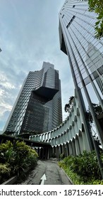 ASIA, SINGAPORE - 11 December 2020 : Modern Unique Exterior Design High Scrapper Office Cum Hotel And Residential Apartments From Low Angle View Looking Up, In City CBD Financial District.