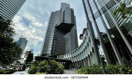 ASIA, SINGAPORE - 11 December 2020 : Modern Unique Exterior Design High Scrapper Office Cum Hotel And Residential Apartments From Low Angle View Looking Up, In City CBD Financial District.