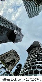 ASIA, SINGAPORE - 11 December 2020 : Modern Unique Exterior Design High Scrapper Office Cum Hotel And Residential Apartments From Low Angle View Looking Up, In City CBD Financial District.