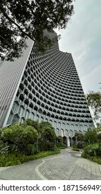 ASIA, SINGAPORE - 11 December 2020 : Modern Unique Exterior Design High Scrapper Office Cum Hotel And Residential Apartments From Low Angle View Looking Up, In City CBD Financial District.