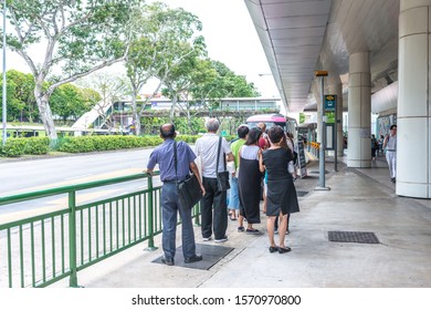 Asia / Singapore - Nov 22, 2019 : Asian People Queuing Up For Public Transport Bus