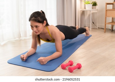 Asia Sport Woman Training Plank In Living Room