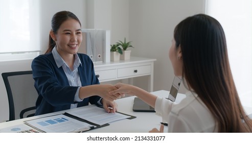 Asia startup SME woman people happy smile talking in wealth service plan advice deal, home loan will at lawyer desk sale office. HR job consult sign in legal paper. Bank trust in Trader tax agent. - Shutterstock ID 2134331077