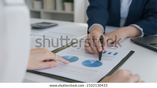 Asia stock trader agent or Sale tax loan broker\
advice brief and point hand to graph report talk to client at\
office desk show budget chart data or legal result on claim form.\
Trust will in work plan.