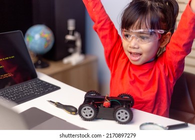 Asia students learn at home in coding robot cars and electronic board cables in STEM, STEAM, mathematics engineering science technology computer code in robotics for kids concept.