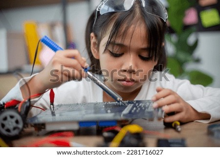 Asia students learn at home in coding robot cars and electronic board cables in STEM, STEAM,