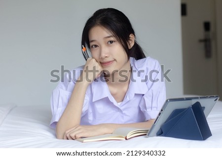 asia thai high school student uniform beautiful girl Write a book