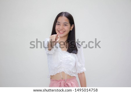 asia thai teen White t-shirt beautiful girl pointing
