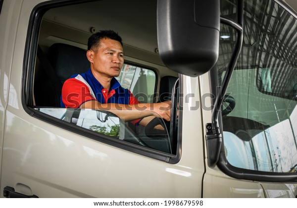 Asia truck driver service for pascel  shipping and\
delivery use commuter van cargo transportation journey for road\
trip around asia