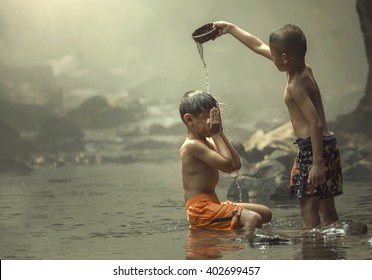 Asia, Two boys showering together.
