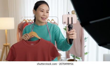 Asia Vlogger Woman Influencer, SME Retail Store Owner Smile Enjoy Selling Show Live Sale Online Screen In IG Story Reel Tiktok Work At Home Tailor Studio. Gen Z People Record Video Selfie Shoot App.