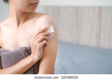 Asia woman applying natural cream, Woman moisturizing her arm with cosmetic cream, Spa and Manicure concept. - Shutterstock ID 2207089333
