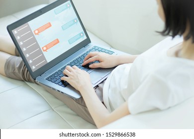 Asia Woman Chat Function In App On Laptop Screen Looking For Customer Support Online