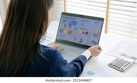 Asia woman expert people AI deep tech talent working on project predict sales insight SEO graph chart plan visual big data science report center BI smart tools screen. Office worker asian analyst job. - Powered by Shutterstock