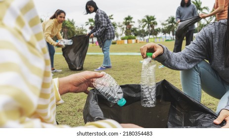 Asia Woman Group Team Volunteer Picking Up Trash Plastics Garbage Plastic Waste. Friend Putting Plastic Garbage Waste Into Bag At Park Concept Team Volunteer Charity Reduce Global Warming Save Earth